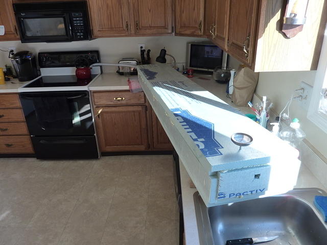 Steam box connected to kettle on stove